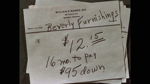1950s: Debts, down payments, monthly payments to businesses written on Vídeo Stock 140123445