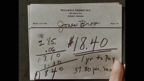 1950s: Debts, down payments, monthly payments to businesses written on Vídeo Stock 140123474