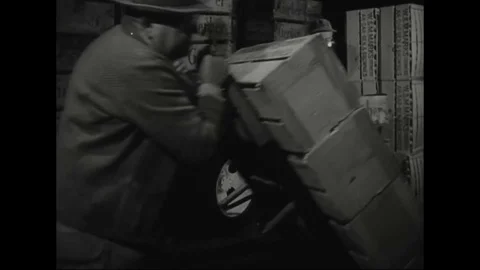 1950s - Delivery trucks bring their wares to a produce market. Stock Footage 79452813