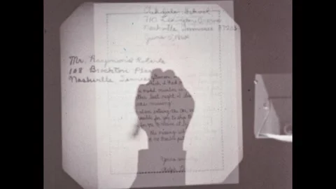 1950s: Dots appear on margins of hand-written business letter. Hand writes on Stock Footage 295293294