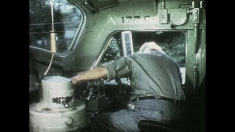 1950s: Engineer leans from window and drives train. Boy enters roomette. Boys Stock Footage 83944182