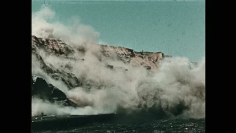 1950s: Explosion on hillside of mine. Two miners walk next to each other. Stock Footage 232180015