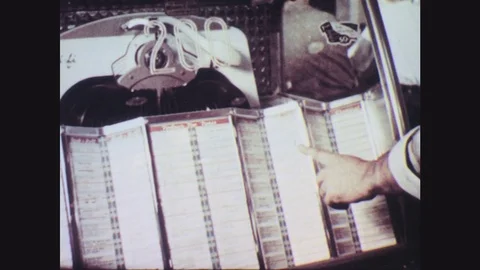 1950s: Finger points, makes selection on jukebox. Man enters diner from back, Stock Footage 77424111