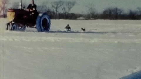 1950s Footage of a Tractor Pulling a Child on a Snow Sled Vidéo 310280685