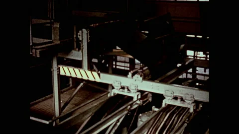 1950s: Graphs and tests in tire factory. Lights flash. Workers at control panel. Stock Footage 152991863
