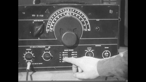 1950s: Hand adjusts knobs on machine. 스톡 동영상 89858359