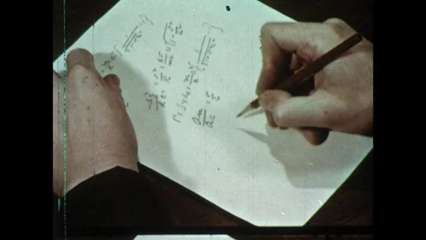 1950s: Hand writes math equations on paper / Zoom in, theory of relativity Stock Footage