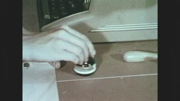 1950s: Hands close bottle. Hands replace plastic on mimeograph stencil. Woman on Stock Footage 85828131