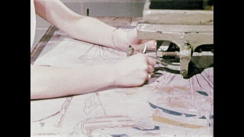 1950s: Hands move printer tracer over design. Machine engraves design on printer Stock Footage 104729513
