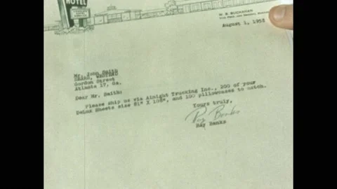 1950s: Hands stack invoices and checks onto desk. Hand flips through swatches of Stock Footage 169707168
