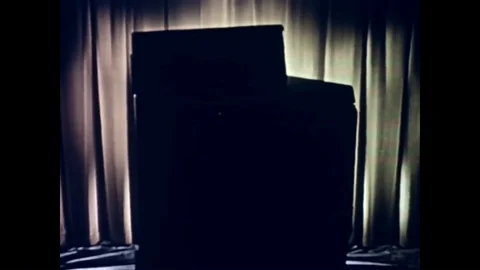 1950s-A housewife turns various knobs on her Frigidaire stove. 스톡 동영상 89628700