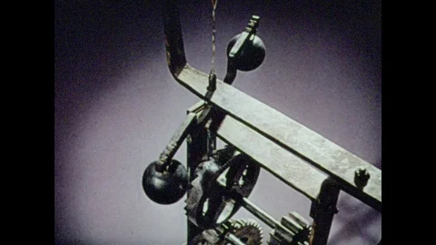 1950s: The inner-workings of a clock. Gears move as the pendulum swings. Stock Footage 82626127