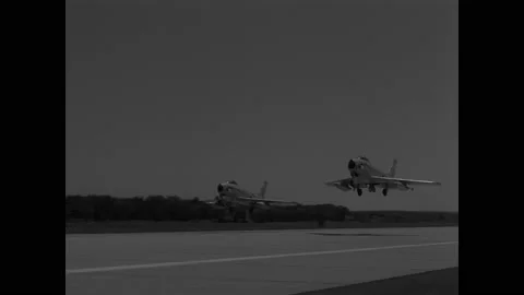 1950s: Jets take off from runway, fly in formation. Line moves around radar 스톡 동영상 148157248