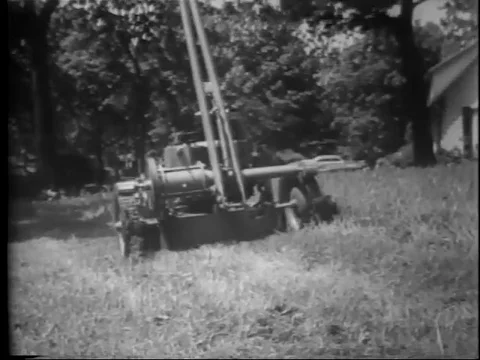 1950s Lawnmover Mows the Lawn by Itself Stock Footage 81908746