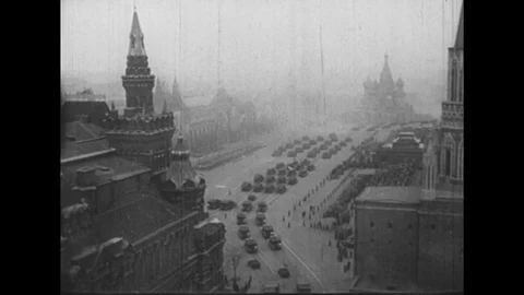 1950s: Long shot of Moscow / Tank pulls rocket / Rocket pulled down street, Stock Footage
