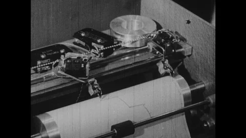 1950s: Machine graphs data on paper. Equipment in lab. Close up of counter. Man Stock Footage 126013664