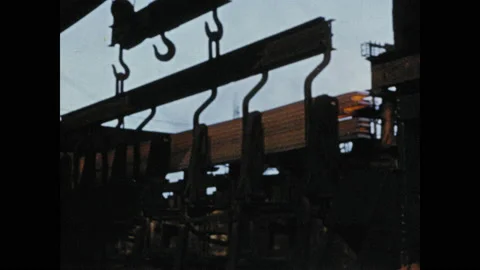 1950s: Machine lifting stack of wood. Close up, pencil writing on chart. Man 動画素材 130357966