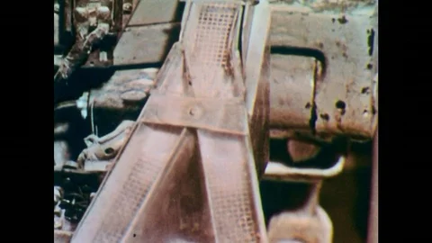 1950s: Machine sorts pills to bottles. Hands scoop red items with large scoop. Stock Footage