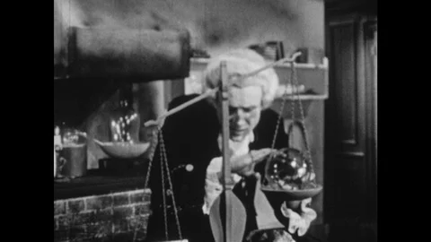 1950s: Man balances items on scale.  Man smiles and walks away. Stock Footage 102004993