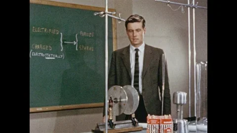 1950s: Man confidently struts across the classroom, purposefully underlining Video stock 84860336