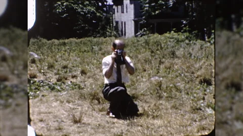 1950s MAN HOLDS CAMERA Takes Makes Picture Vintage Retro Film Home Movie Stock Footage 131512732