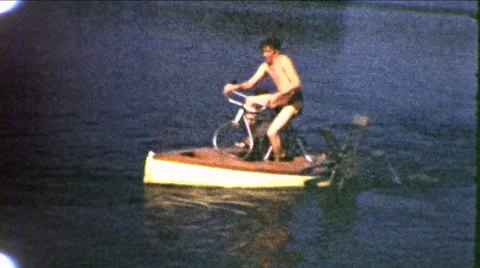 1950s Man Peddles Tiny Paddlewheel Boat Summer Holiday Vintage Film Home Movie Stock Footage 57381766