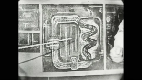 1950s: Man speaks while holding pointer. Man gestures at diagram of submarine. Video stock 169234852