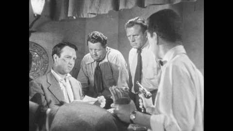 1950s: Man talking, man holds gun on other men. Man talks to men, exits. Man Stock Footage 88665598