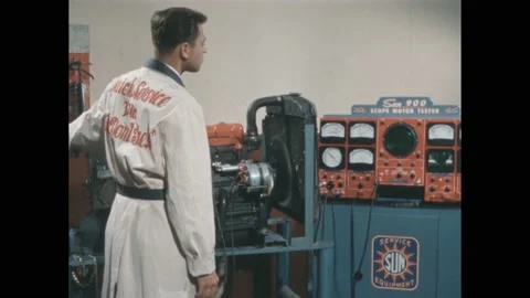 1950s: man testing motor, man working in factory, woman constructing electronic Video stock 171879899