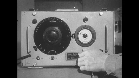 1950s: Man turns knobs on signal generator. 스톡 동영상 89858232