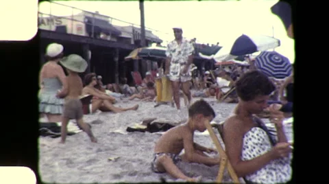1950s Man Walks on Crowded Beach AT THE OCEAN Summer NYC Vintage Film Home Movie Stock-Footage 58668260