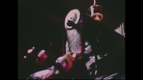 1950s: Mechanical lever moving / Close up of mechanical joint / Low angle of man Stock Footage