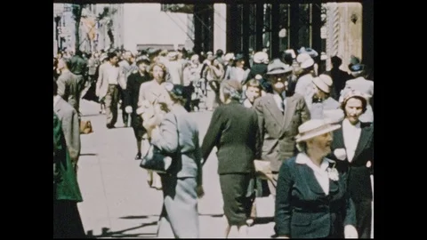 1950s: Men and woman walk around city. Women walk up to window of Tiffany's. Stock Footage