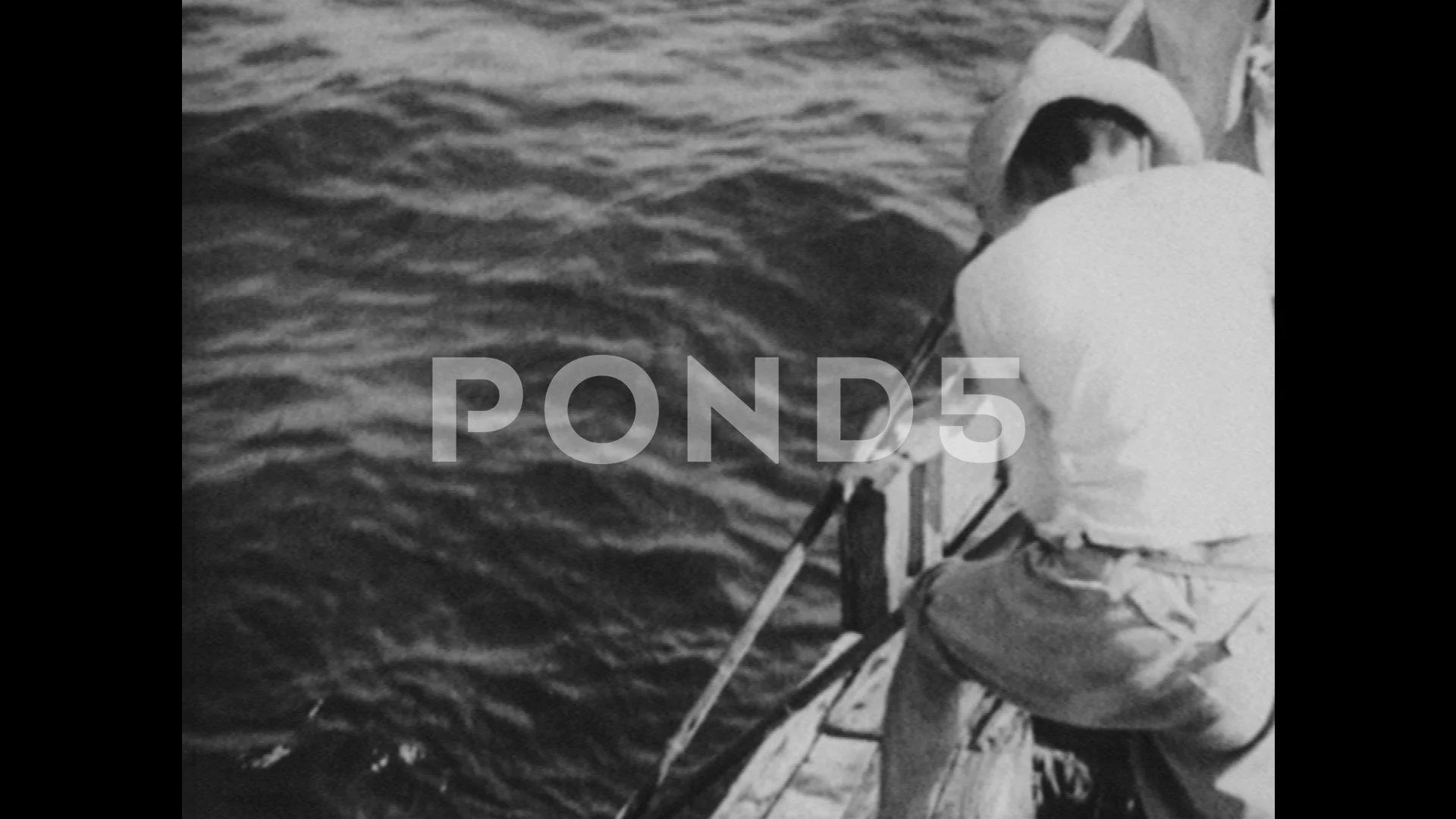 1950s: Men on deck of fishing boat pull , Stock Video