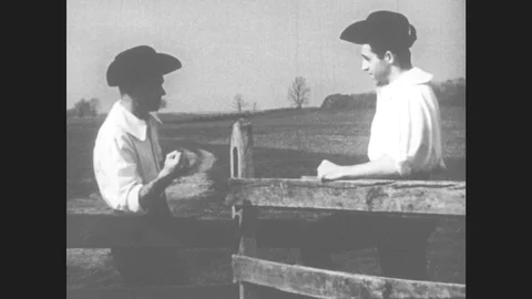 1950s: Men stand at fence and talk. Man lectures. Judge listens. Men sit. Stock Footage
