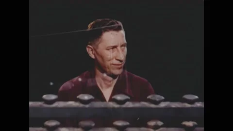 1950s: Men at work on assembly line. Man writes on glass. Sand. Mining furnace. Stock Footage 163609417