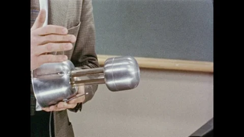 1950s: A miniature Van der Graaf generator, resembling a junior model of the Stock Footage 84862890