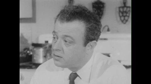 1950s: Mother and father work in yard. M... | Stock Video | Pond5