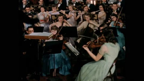 1950s: Musicians playing instruments. Conductor conducting orchestra.  Band 動画素材 169181916