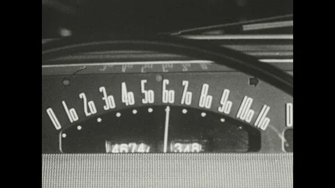 1950s: Needle on speedometer climbs. Foot steps on brake pedal. Stock Footage 126009550