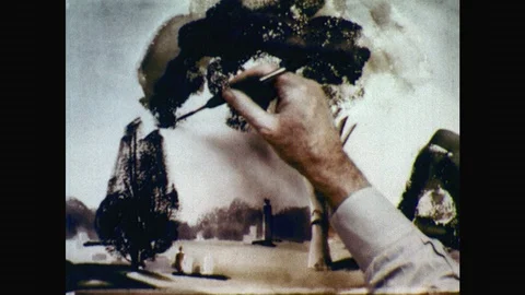 1950s: Painter uses narrow brush to paint in smaller branches from foliage. Stock Footage 98332829