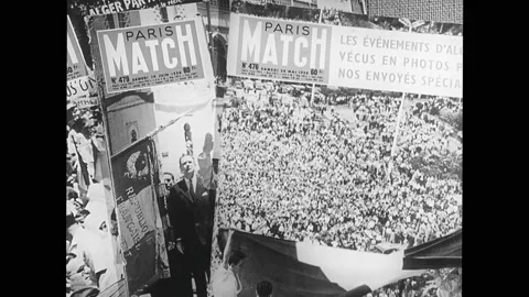 1950s: Paris Match covers about the Algerian War. John F. Kennedy speaking Stock Footage 169233313