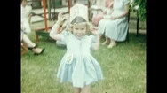 1950S: Party.  Little Girls Play In Yard.  Cat Does Tricks.  Girls Stand Stock Footage
