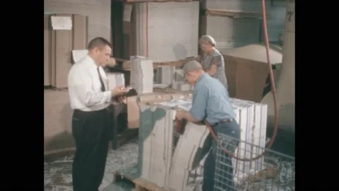 1950s: people in office working to shred large stacks of paper, orchestra Stock Footage