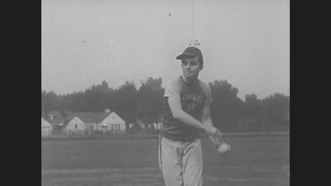 1950s: Pitcher throws softball. Catcher throws ball from plate. Close up of rule Stock Footage 79695258
