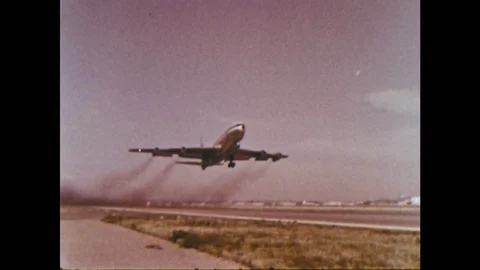 1950s: Plane takes off. Plane lands at sunset. Airport at night. Stock Footage 75164504