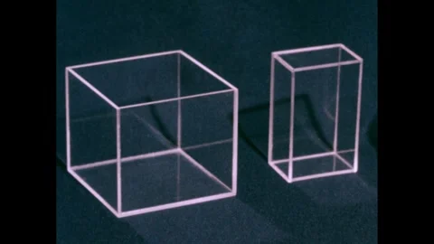 1950s: Plastic boxes. Hand with clapboard. Plastic shapes on table, hand picks Stock Footage 240676702