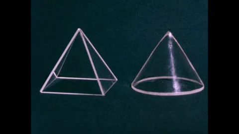 1950s: Plastic cones in boxes, boxes disappear. Hand sets down wooden block, Stock Footage 240676775