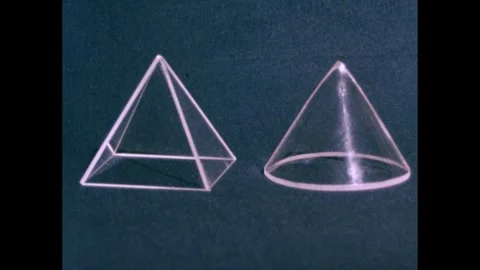 1950s: Plastic cones on table. Hand with clapboard. Hand sets down wooden block, Stock Footage 240676727