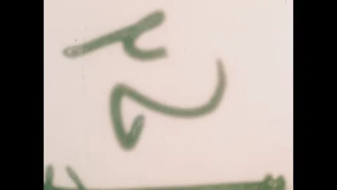 1950s: Plastic cones on table, hand picks up cones, places box over cone. Stock Footage 240676769